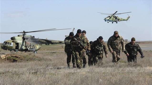 Ukrainian servicemen leave Navy base in Sevastopol as Crimea...