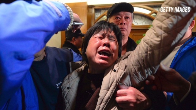 Uncertainty haunts Flight 370 relatives as weather delays search